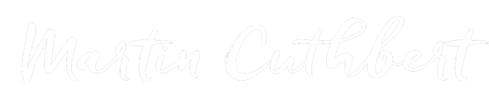 Marting cuthbert written in white color font